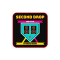 A square sticker or decal with rounded corners featuring a black background and a colorful graphic. The design shows the text 'SECOND DROP SOUND SYSTEM' in yellow and pink, a teal speaker-shaped emblem with speakers and a pink X, and yellow text reading 'NO PERMISSION REQUIRED' on a white border.