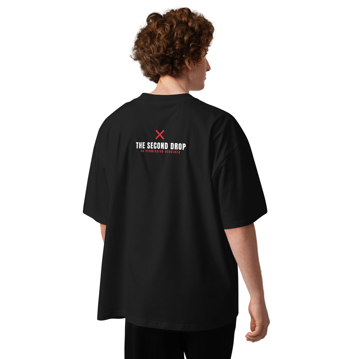 a person wearing an oversized shirt with The Second Drop on the back of the shirt with a red X No Permission Required