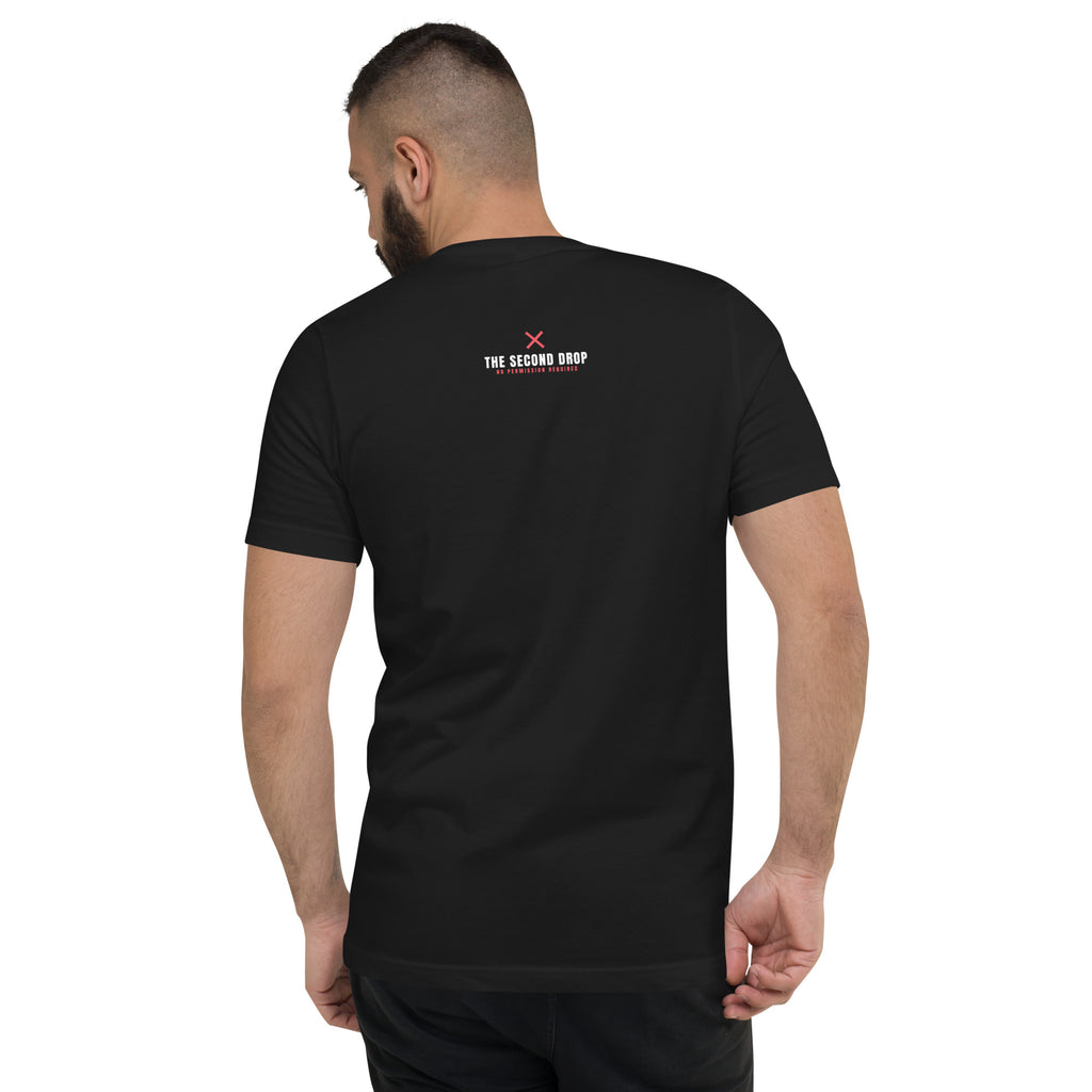 A man wearing a black V-neck t-shirt  showing the back of the shirt with THE SECOND DROP' No Permission Required