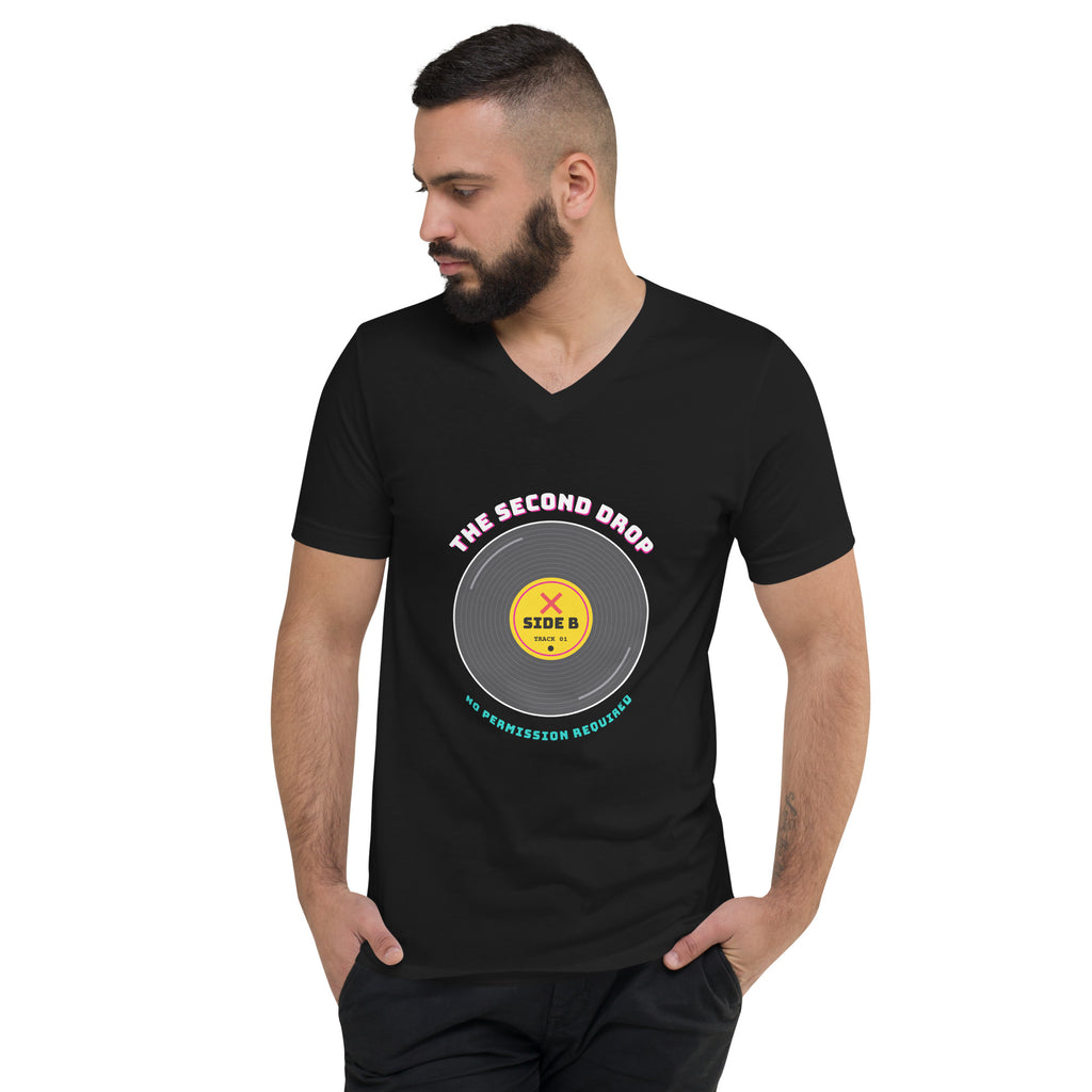 A man wearing a black V-neck t-shirt with a graphic print of a vinyl record labeled 'THE SECOND DROP' and 'SIDE B' on a plain white background. No Permission Required